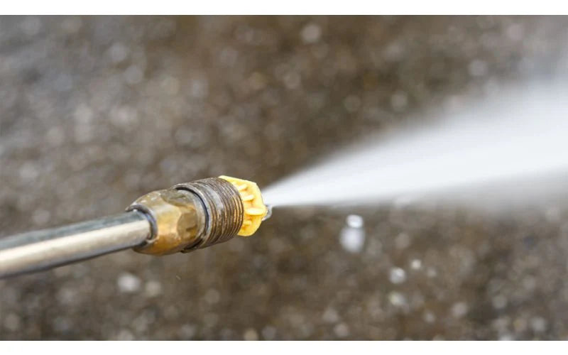 a pressure washer with a nozzle spraying water