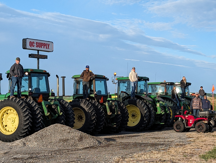 several tractors lined up side by side